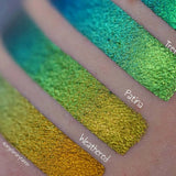 Right angled close up arm swatches on fair skin tone of Weathered Jewelled Multichrome Eyeshadow shifts compared to Trefoil, Patina