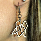 Maple Clionadh symbol earrings being worn