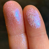 Close up finger swatches on fair skin tone of Spotlight Glitter Multichrome Eyeshadow